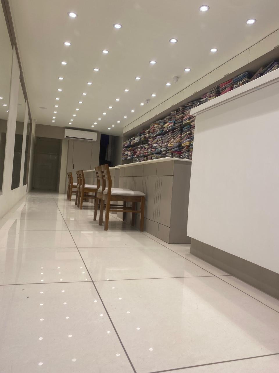 Panaash Showroom - Spacious interior with mirrors and fabric displays